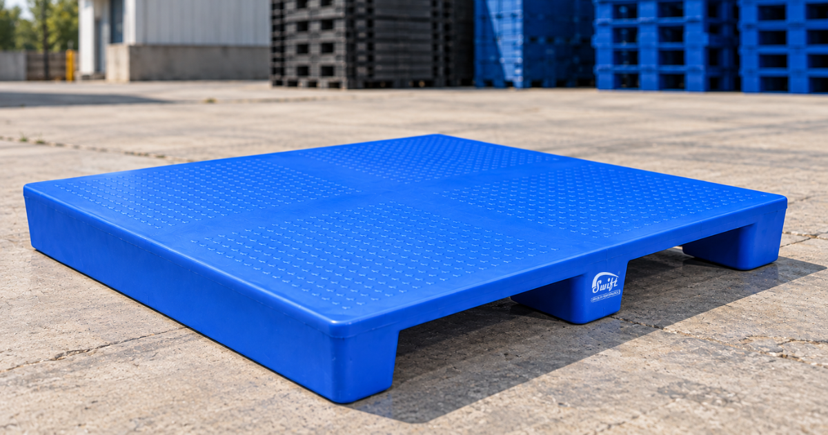 Blue 2 Way Entry Non Reversible Plastic Pallet in an outdoor industrial facility