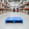 Blue plastic pallet in a modern industrial warehouse