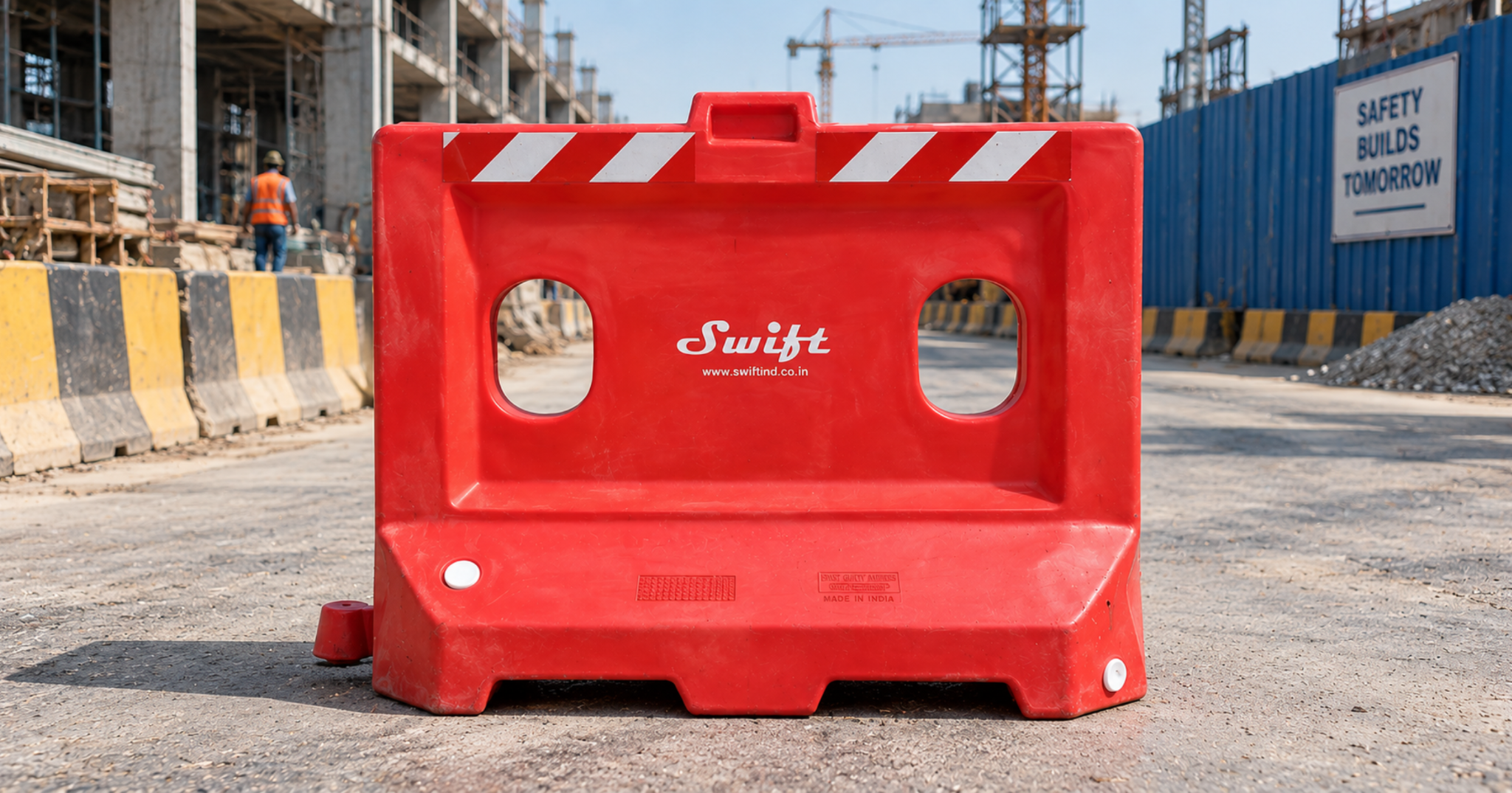 Red plastic road safety barricades installed on an urban road for traffic control